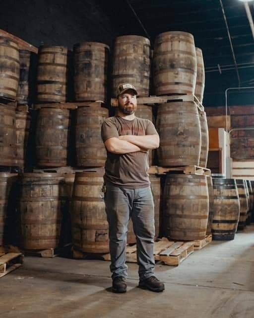 Brian Robertson in a barrel warehouse